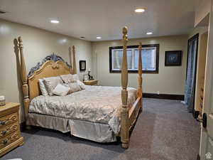 Carpeted bedroom featuring recessed lighting and baseboards