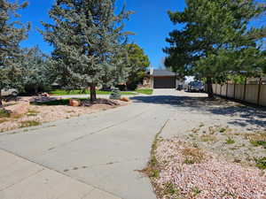 View of front of property with a garage and driveway