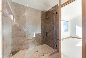 Full bath featuring a shower stall