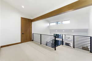 Stairs with carpet floors, recessed lighting, and a high ceiling