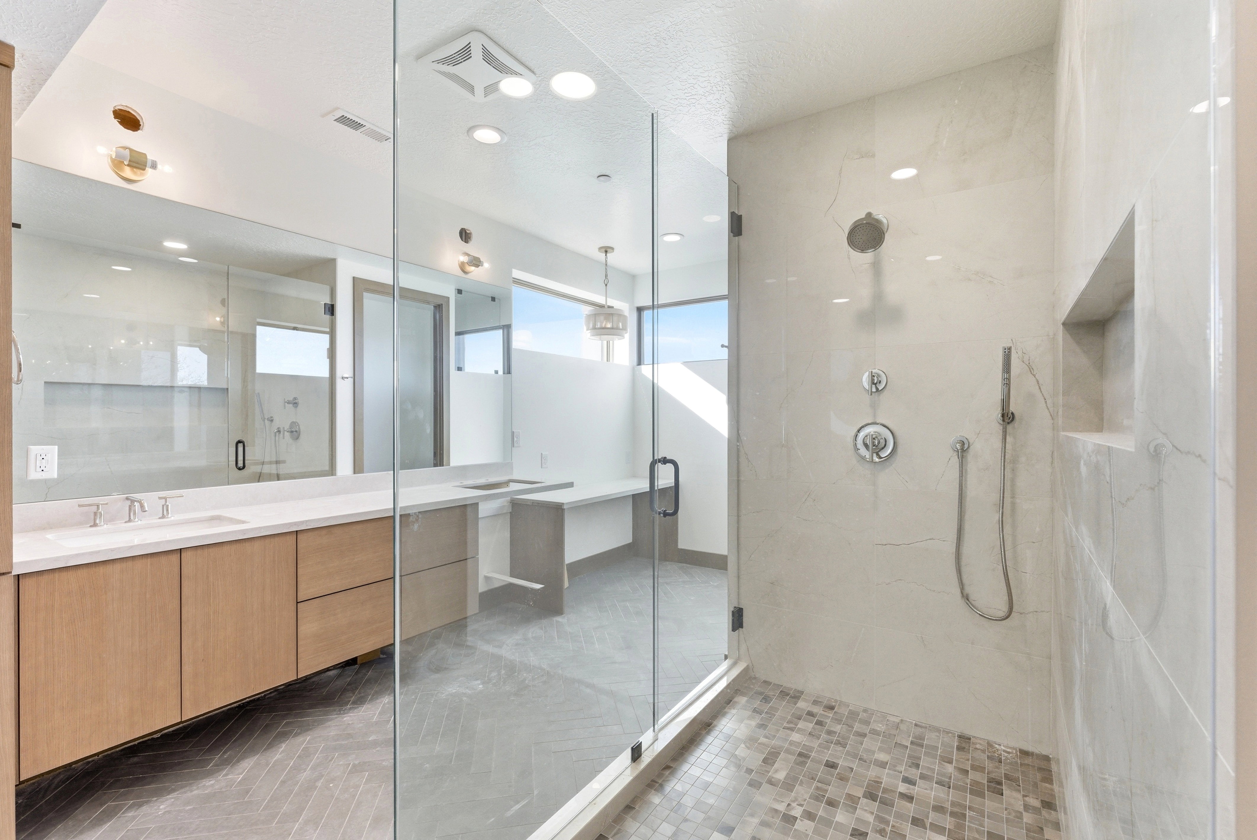 Full bathroom featuring vanity, a marble finish shower, a textured ceiling, and recessed lighting