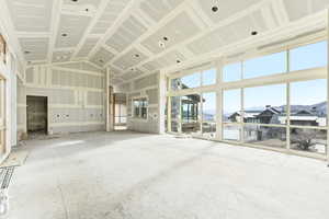 Great Room and Kitchen featuring high vaulted ceiling and mountain views