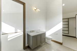Bathroom with vanity and recessed lighting