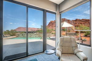 Sunroom featuring a mountain view and plenty of natural light