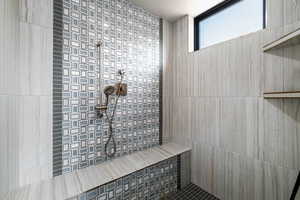Bathroom featuring tiled shower
