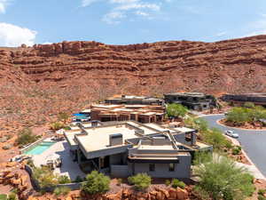 View of subject property featuring a pool and mountains