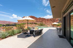 View of patio / terrace featuring a mountain view and an outdoor pool