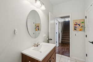 Bathroom featuring vanity and tile patterned floors