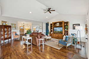 Living room featuring ceiling fan, wood finished floors, high vaulted ceiling, and recessed lighting