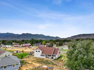 View of mountain background featuring nearby suburban area