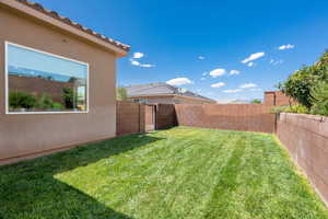 View of fenced backyard