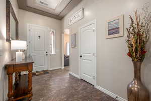 Entrance foyer featuring arched walkways and baseboards