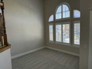 Empty room featuring carpet and healthy amount of natural light