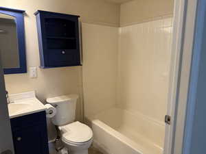 Full bath featuring vanity and bathing tub / shower combination