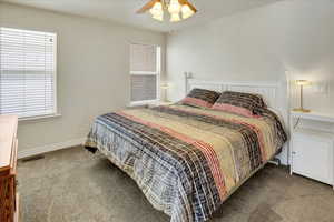 Primary Bedroom featuring carpet floors and ceiling fan.