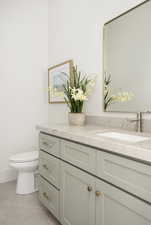 Bathroom with vanity and tile patterned floors