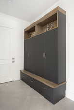 Mudroom with light tile patterned floors