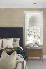 Bedroom with carpet floors and ornamental molding