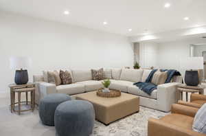 Living area featuring recessed lighting and light carpet