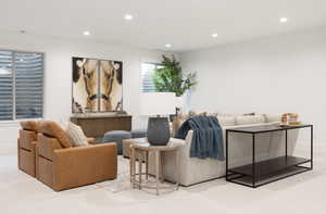 Carpeted living room featuring recessed lighting