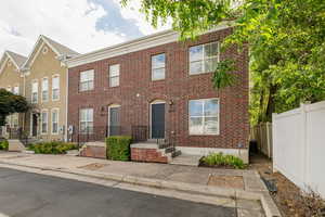 View of front of house with brick siding