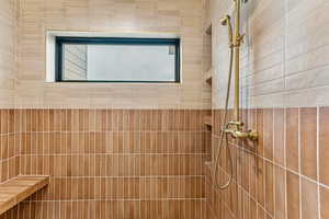 Bathroom view of a tile shower