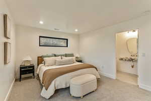 Bedroom featuring light carpet and recessed lighting