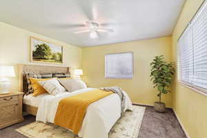 Bedroom featuring carpet flooring and ceiling fan
