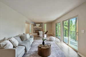 Living area with wood finished floors and a fireplace
