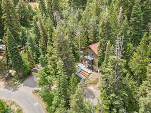 Aerial overview of property's location featuring a heavily wooded area