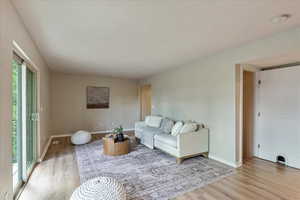 Living area with light wood-type flooring