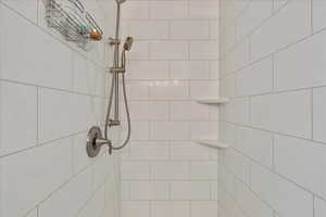 Bathroom view of a tile shower