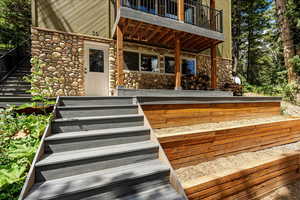 View of exterior entry with stone siding