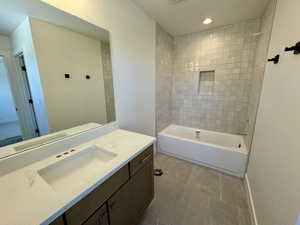 Full bath with vanity, tile patterned flooring, recessed lighting, and bathtub / shower combination