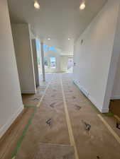 Hall featuring baseboards and recessed lighting