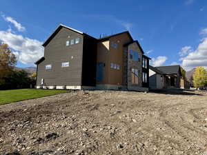 View of side of home with stone siding