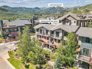 Aerial view of residential area featuring a mountain backdrop