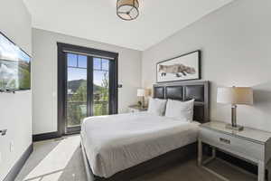 Bedroom featuring access to exterior and carpet flooring