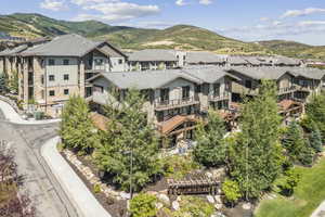 Aerial perspective of suburban area featuring a mountainous background