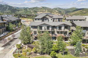 Aerial perspective of suburban area featuring a mountainous background