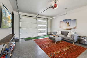 Garage featuring a garage door opener
