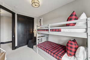 Bedroom with carpet and baseboards