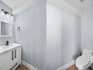 Bathroom with vanity and wood finished floors