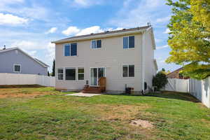 Back of house featuring a fenced backyard