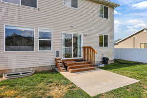 Rear view of property featuring a patio