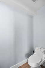 Bathroom featuring wood finished floors and a textured ceiling