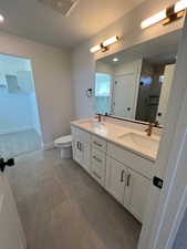 Primary Suite Bath w/ quartz countertops, painted cabinets & double sinks!
