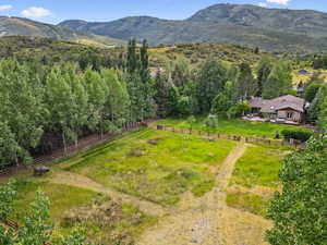View of mountain backdrop featuring rural landscape