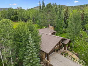 View from above of property with a forest