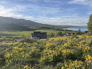 Mountain view featuring a nearby body of water and rural landscape